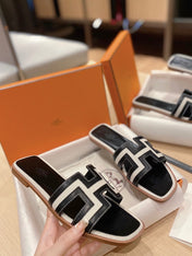 0RAN SANDALS IN BLACK CALFSKIN AND WHITE CANVAS
