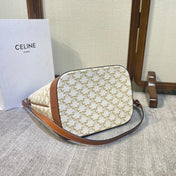 BUCKET 33 IN WHITE TRIOMPHE CANVAS AND BRONZE BROWN CALFSKIN TRIM