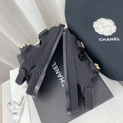 CHANEL 26S SANDALS IN BLACK FABRIC WITH PEARL-EMBELLISHED LOGO