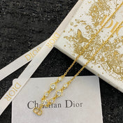 CD 26S CD LOGO CZ STATION NECKLACE IN GOLD TONE METAL 631851