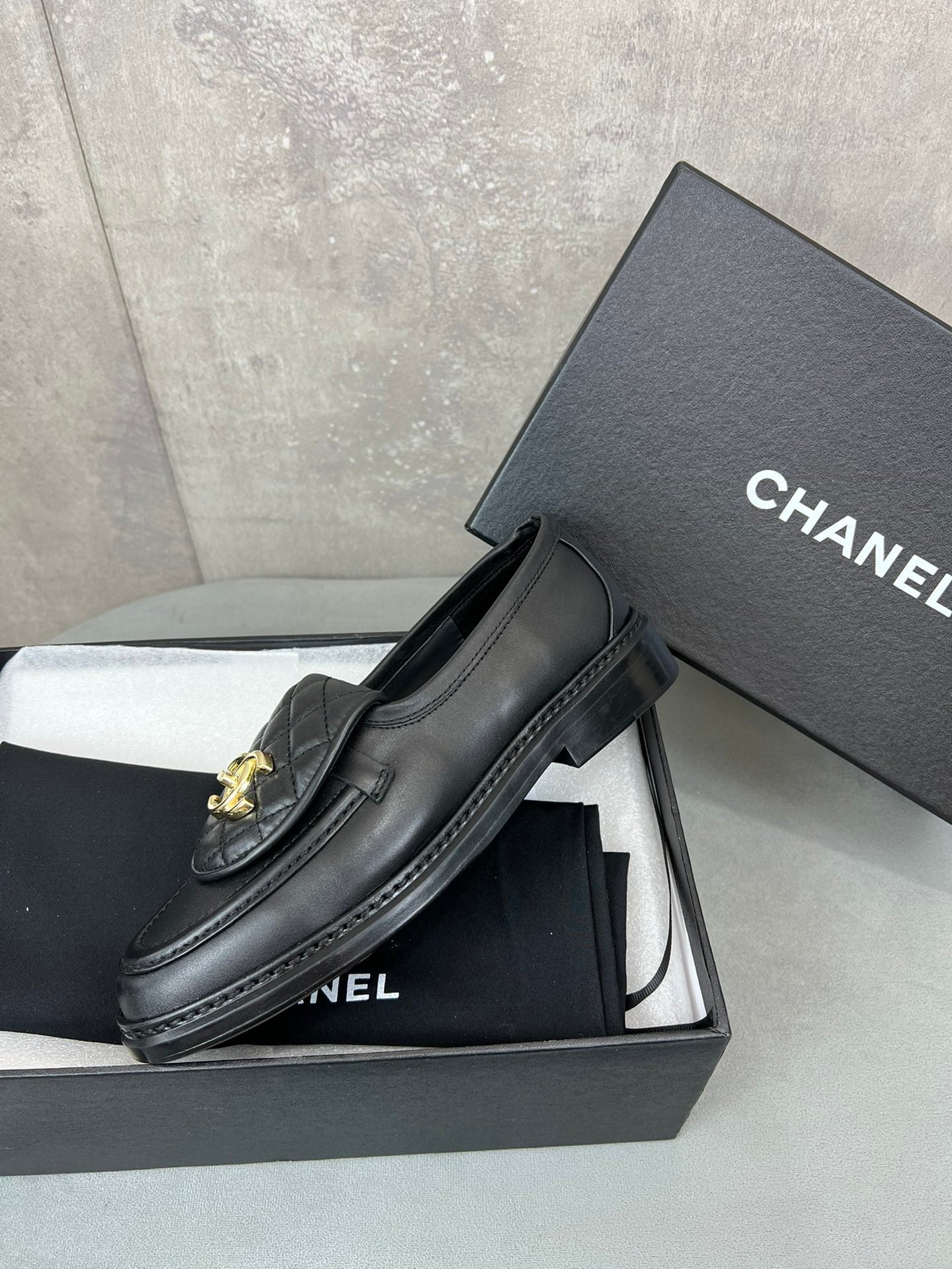 CHANEL 26S LOAFERS IN BLACK QUILTED CALFSKIN WITH CC LOGO