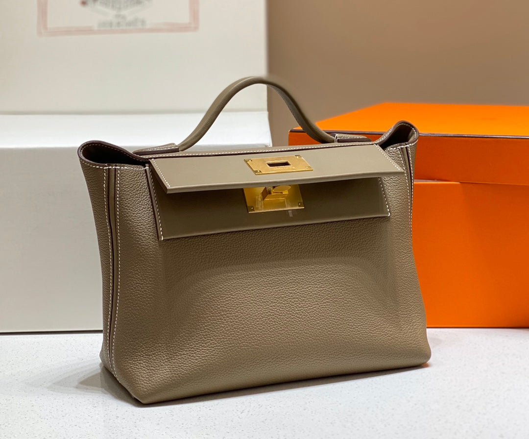 HM 26S 24/24 29MM IN BROWN EVERCOLOR CALFSKIN GOLD KELLY BUCKLE