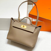HM 26S 24/24 29MM IN BROWN EVERCOLOR CALFSKIN GOLD KELLY BUCKLE