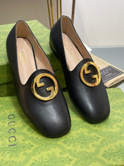 BLONDIE LOGO-PLAQUE LOAFERS IN BLACK CALFSKIN WITH GOLD HARDWARE