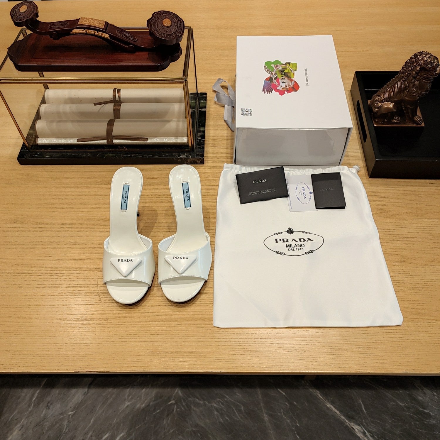 PRADA 26S OPEN TOE MULES 100MM IN IVORY WHITE PATENT CALFSKIN WITH LOGO