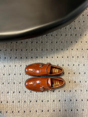 MIUMIU 26S CHURCH BROGUE MONK STRAP SHOES IN RUST ORANGE PATENT CALFSKIN