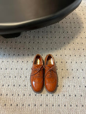 MIUMIU 26S LACE-UP BROGUE LOAFERS IN RUST ORANGE PATENT CALFSKIN