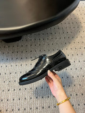 MIUMIU 26S LACE-UP BROGUE LOAFERS IN BLACK PATENT CALFSKIN