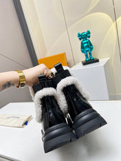 LV RUBY FLAT ANKLE BOOT IN BLACK CALFSKIN AND WHITE SHEARLING