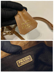 BUCKET BAG 19 IN RUSSET BROWN RE-NYLON AND CALFSKIN HANDLE