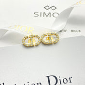 CD 26S CRYSTAL LOGO STUD EARRINGS IN GOLD METAL 633106