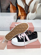 WASHED-DENIM SNEAKERS IN BLACK CANVAS WITH BROWN AND STRIPED LACES
