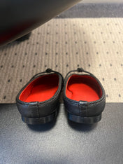 BOTTEGA VENETA 26S FLAT MULES IN BLACK LAMBSKIN