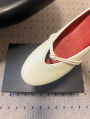 BOTTEGA VENETA 26S FLAT MULES IN CREAM WHITE LAMBSKIN