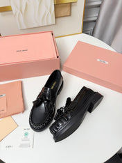MIUMIU 26S TASSEL LOAFERS IN BLACK CALFSKIN