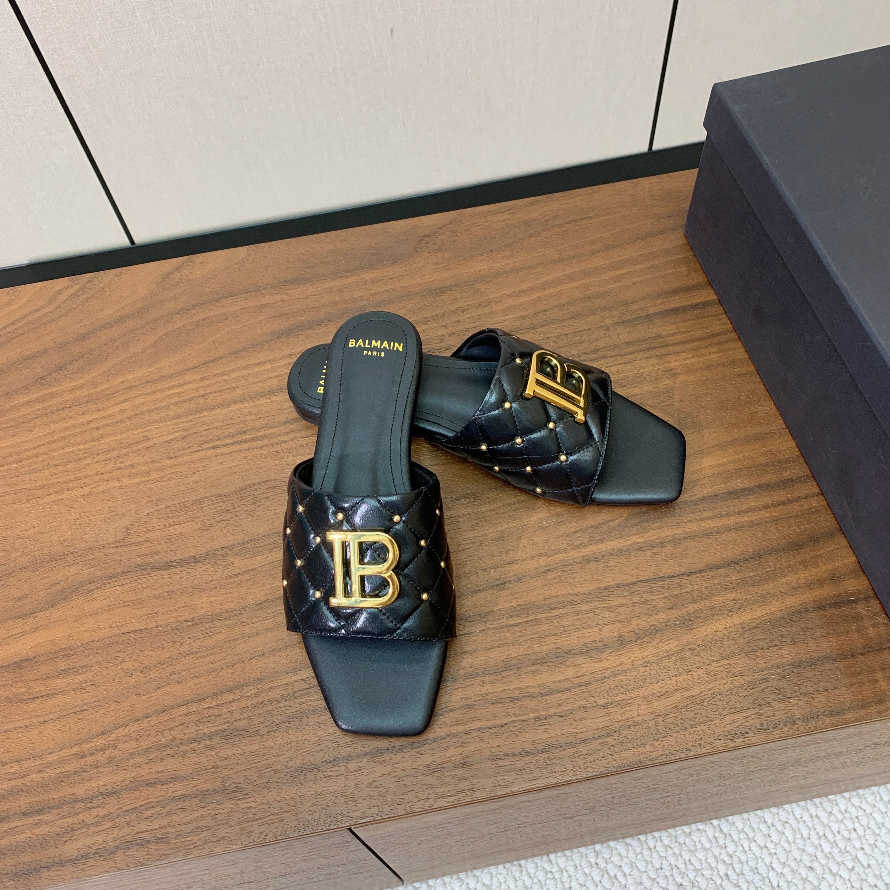 BALMAIN 26S QUILTED MULES IN BLACK CALFSKIN