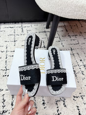 DIOR 26S HIGH HEEL SLIDES IN BLACK AND WHITE EMBOSSED OBLIQUE LACE EMBROIDERY