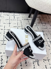 DIOR 26S HIGH HEEL SLIDES IN BLACK AND WHITE EMBOSSED OBLIQUE LACE EMBROIDERY