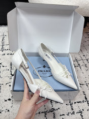 PRADA 26S POINTED-TOE HIGH HEELS 55MM IN WHITE CALFSKIN WITH BOW