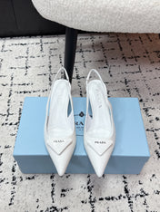 PRADA 26S SLINGBACK PUMPS 60MM IN WHITE PATENT CALFSKIN