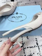 PRADA 26S SLINGBACK PUMPS 60MM IN CREAM WHITE PATENT CALFSKIN
