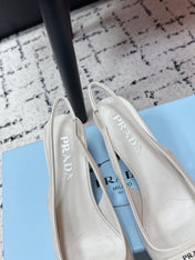 PRADA 26S SLINGBACK PUMPS 60MM IN CREAM WHITE PATENT CALFSKIN