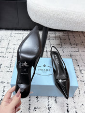 PRADA 26S SLINGBACK PUMPS 60MM IN BLACK PATENT CALFSKIN