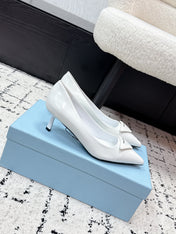 PRADA 26S POINTED-TOE HIGH HEELS 60MM IN WHITE PATENT CALFSKIN WITH LOGO