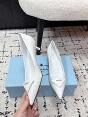 PRADA 26S POINTED-TOE HIGH HEELS 60MM IN WHITE PATENT CALFSKIN WITH LOGO