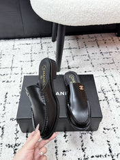 CHANEL 26S MULE LOAFERS IN BLACK SMOOTH CALFSKIN WITH CC LOGO