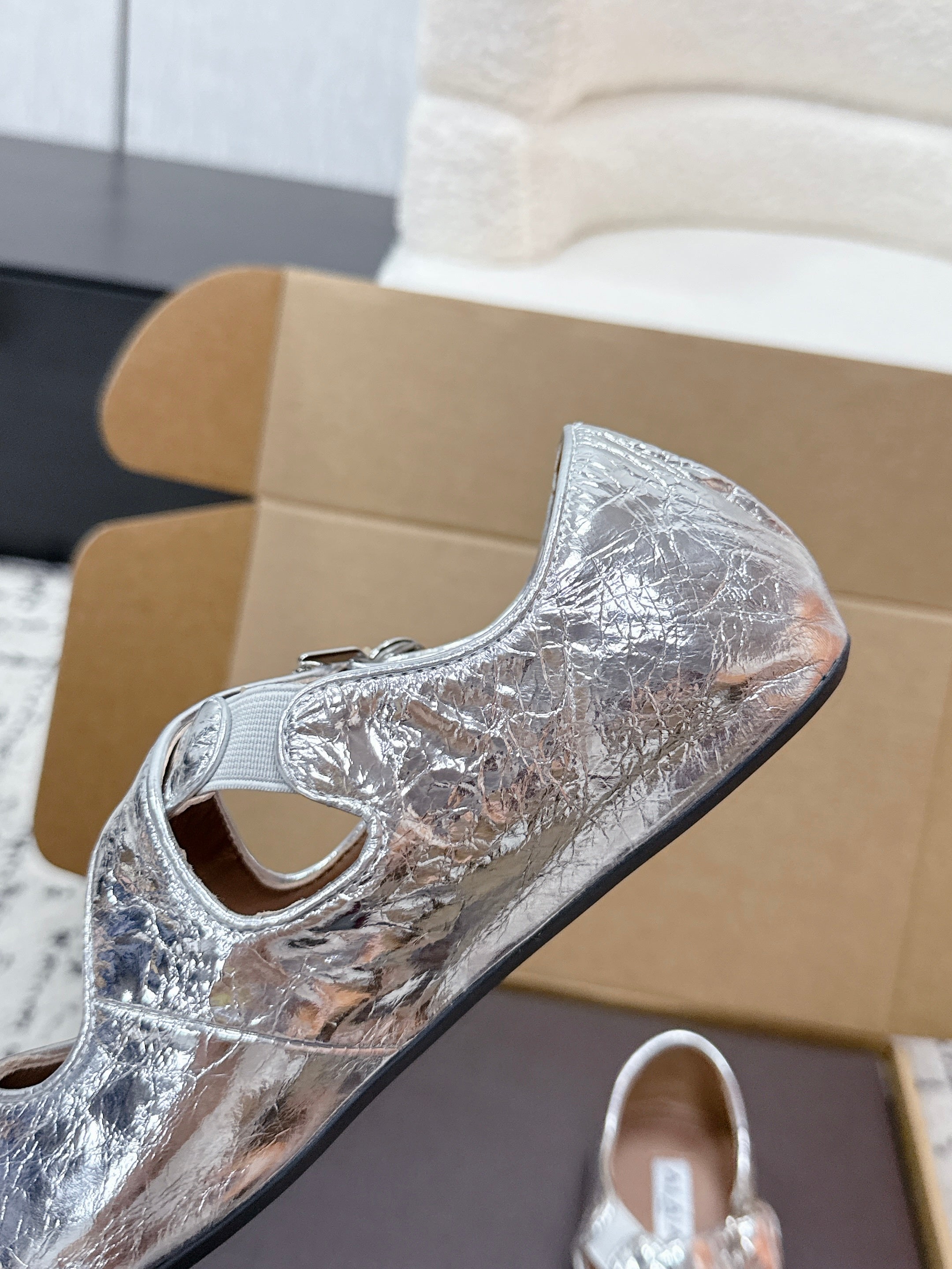 ALAIA 26S CROSS-STRAP BALLET FLATS IN SILVER LAMBSKIN