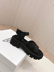 PRADA 26S CROSS STRAP CHUNKY SOLE SANDALS IN BLACK CANVAS