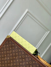 POCHETTE VOYAGE 26 IN LEMON YELLOW MONOGRAM ECLIPSE CALFSKIN