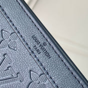 POCHETTE VOYAGE 22 IN DARK BLUE MONOGRAM SHADOW CALFSKIN