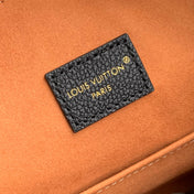 LOW KEY COOKIE MM 32 IN BLACK CALFSKIN BROWN MONOGRAM TAG