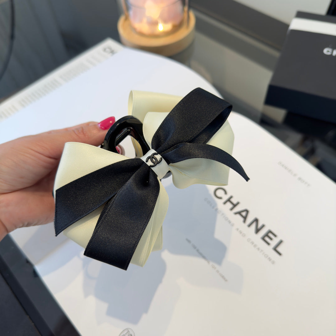 CHANEL 26S BOW HAIR CLIP IN BLACK AND WHITE SATIN 503131