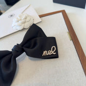 CHANEL 26S BOW HAIR CLIP IN BLACK SATIN 503134