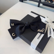 CHANEL 26S BOW HAIR CLIP IN BLACK SATIN 503134