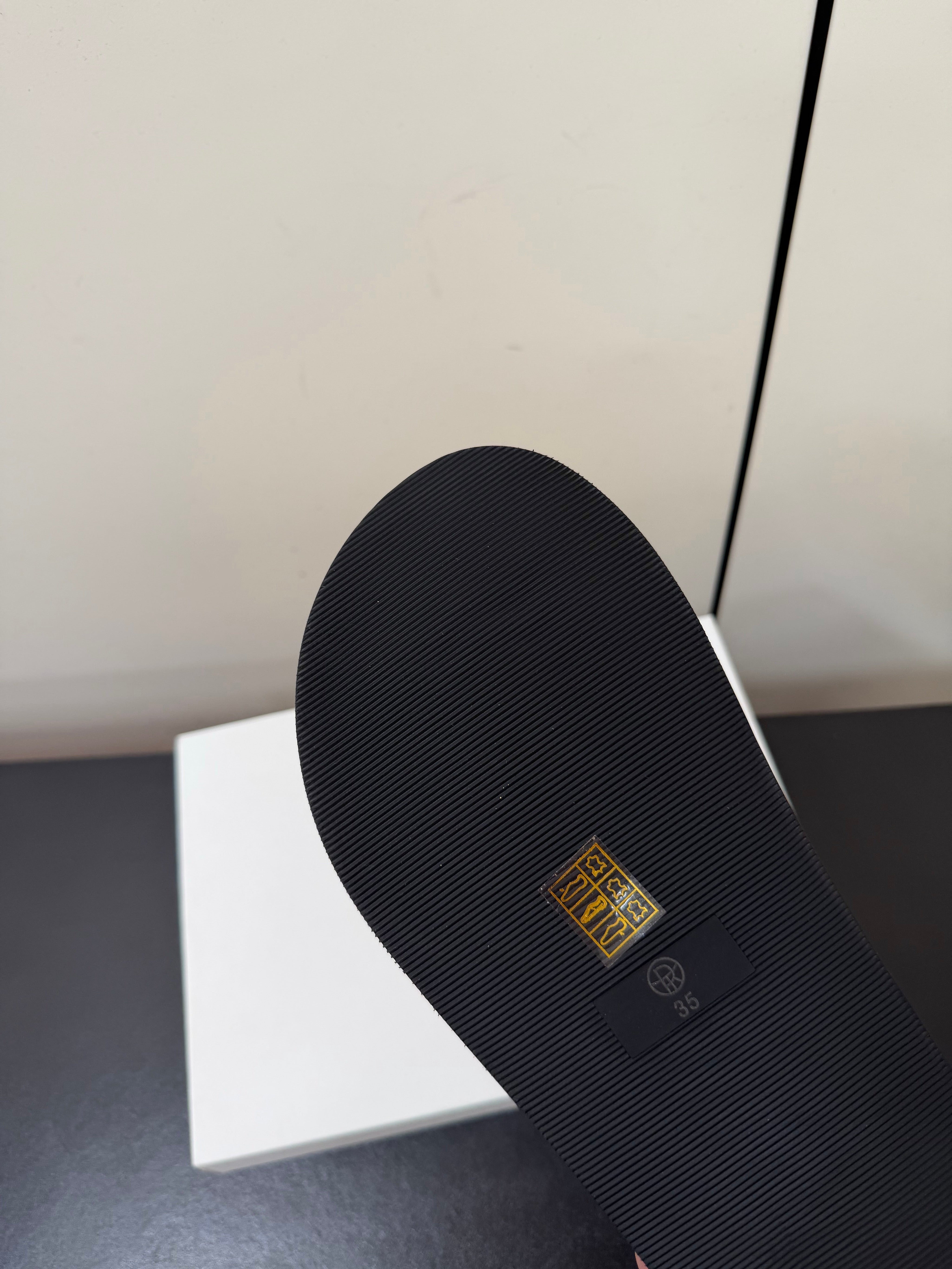 THE ROW 26S CROSS STRAP SANDALS IN BLACK CALFSKIN