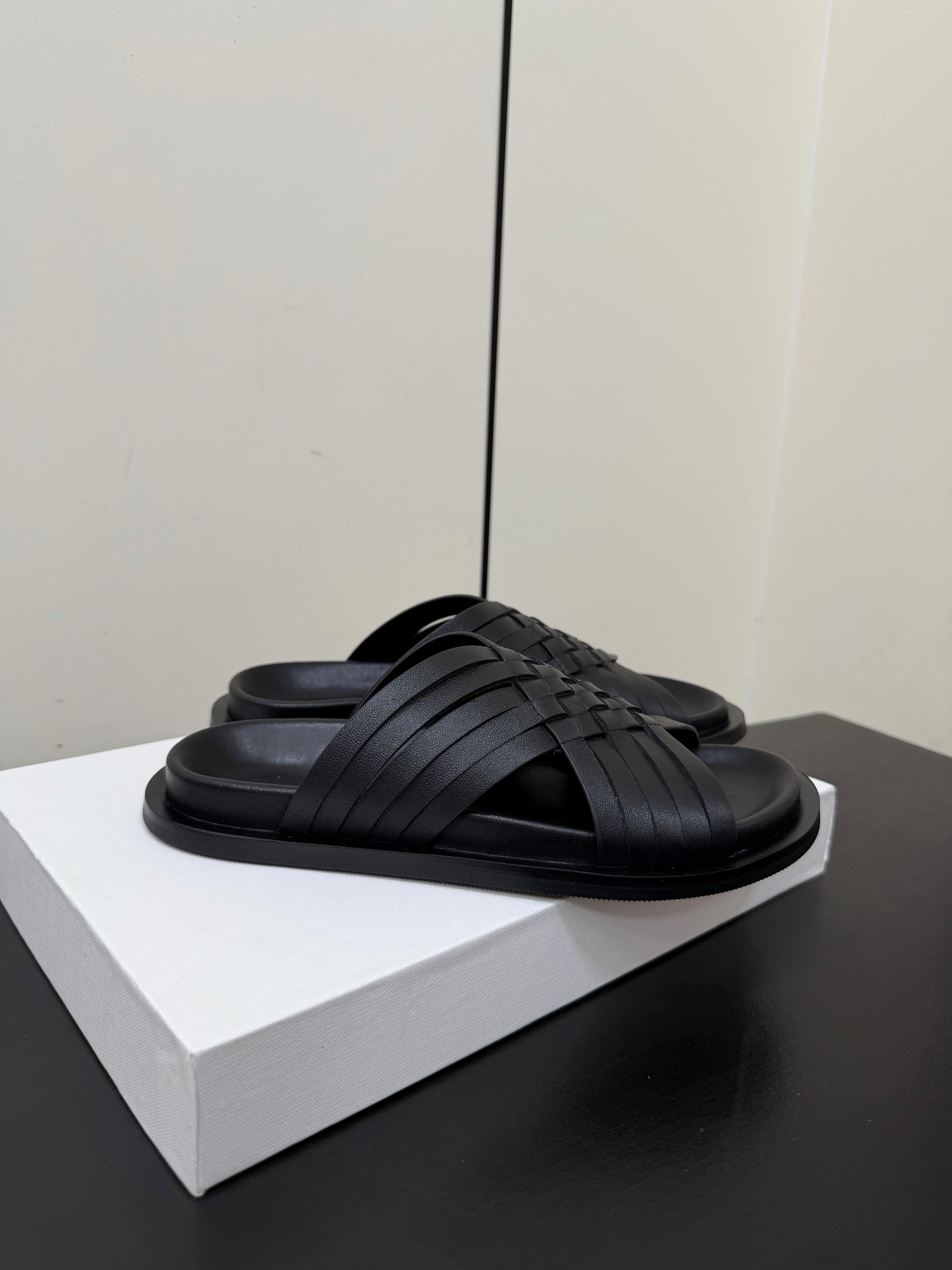 THE ROW 26S CROSS STRAP SANDALS IN BLACK CALFSKIN