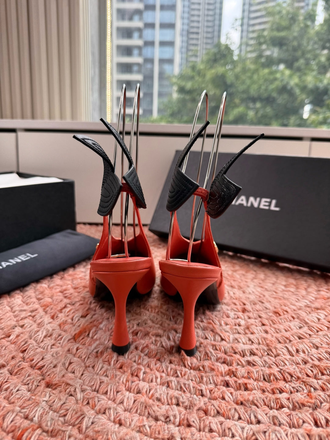 CHANEL 26S POINTED TOE HIGH HEEL SLINGBACKS IN ORANGE LAMBSKIN WITH BLACK FLORAL APPLIQUE