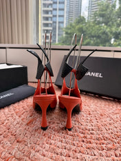 CHANEL 26S POINTED TOE HIGH HEEL SLINGBACKS IN ORANGE LAMBSKIN WITH BLACK FLORAL APPLIQUE
