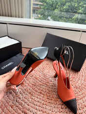 CHANEL 26S POINTED TOE HIGH HEEL SLINGBACKS IN ORANGE LAMBSKIN WITH BLACK FLORAL APPLIQUE