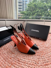 CHANEL 26S POINTED TOE HIGH HEEL SLINGBACKS IN ORANGE LAMBSKIN WITH BLACK FLORAL APPLIQUE