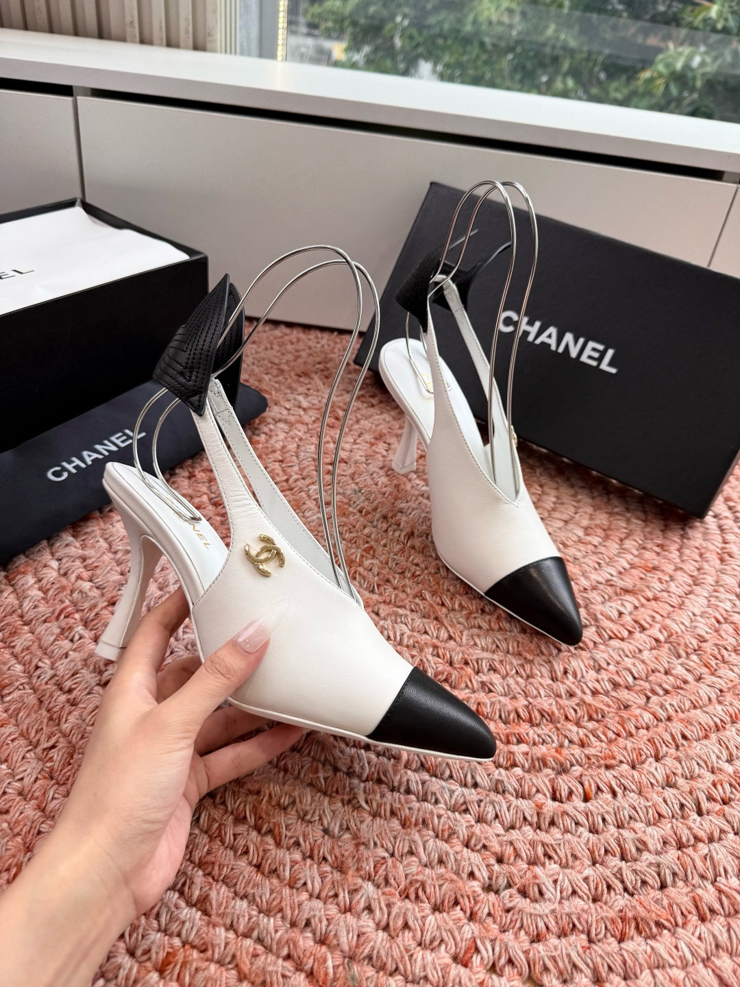 CHANEL 26S POINTED TOE HIGH HEEL SLINGBACKS IN WHITE LAMBSKIN WITH BLACK FLORAL APPLIQUE