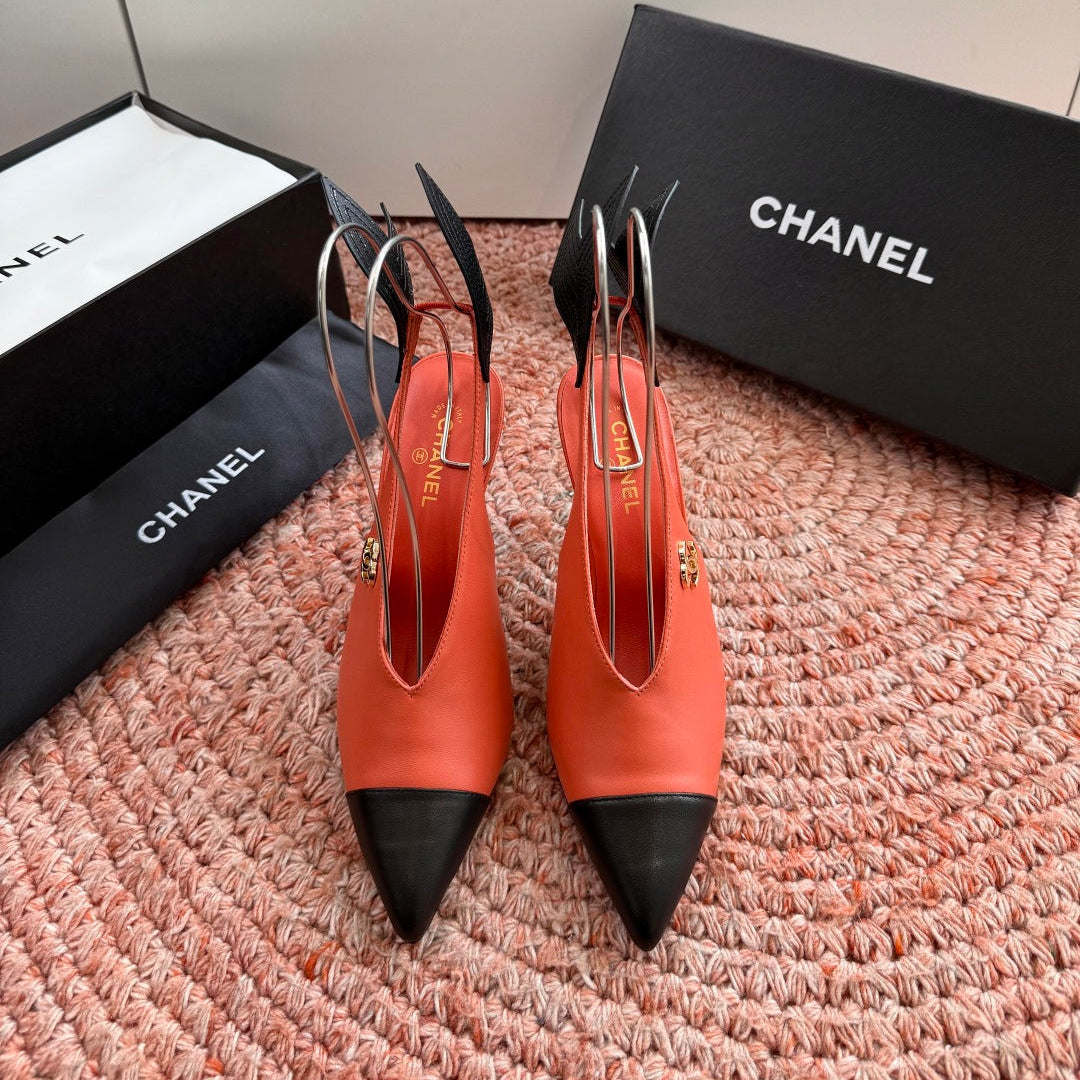 CHANEL 26S POINTED TOE HIGH HEEL SLINGBACKS IN ORANGE LAMBSKIN WITH BLACK FLORAL APPLIQUE