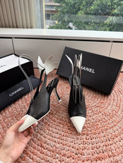 CHANEL 26S POINTED TOE HIGH HEEL SLINGBACKS IN BLACK AND WHITE LAMBSKIN WITH FLORAL APPLIQUE