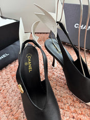 CHANEL 26S POINTED TOE HIGH HEEL SLINGBACKS IN BLACK AND WHITE LAMBSKIN WITH FLORAL APPLIQUE