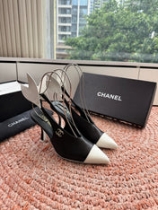 CHANEL 26S POINTED TOE HIGH HEEL SLINGBACKS IN BLACK AND WHITE LAMBSKIN WITH FLORAL APPLIQUE