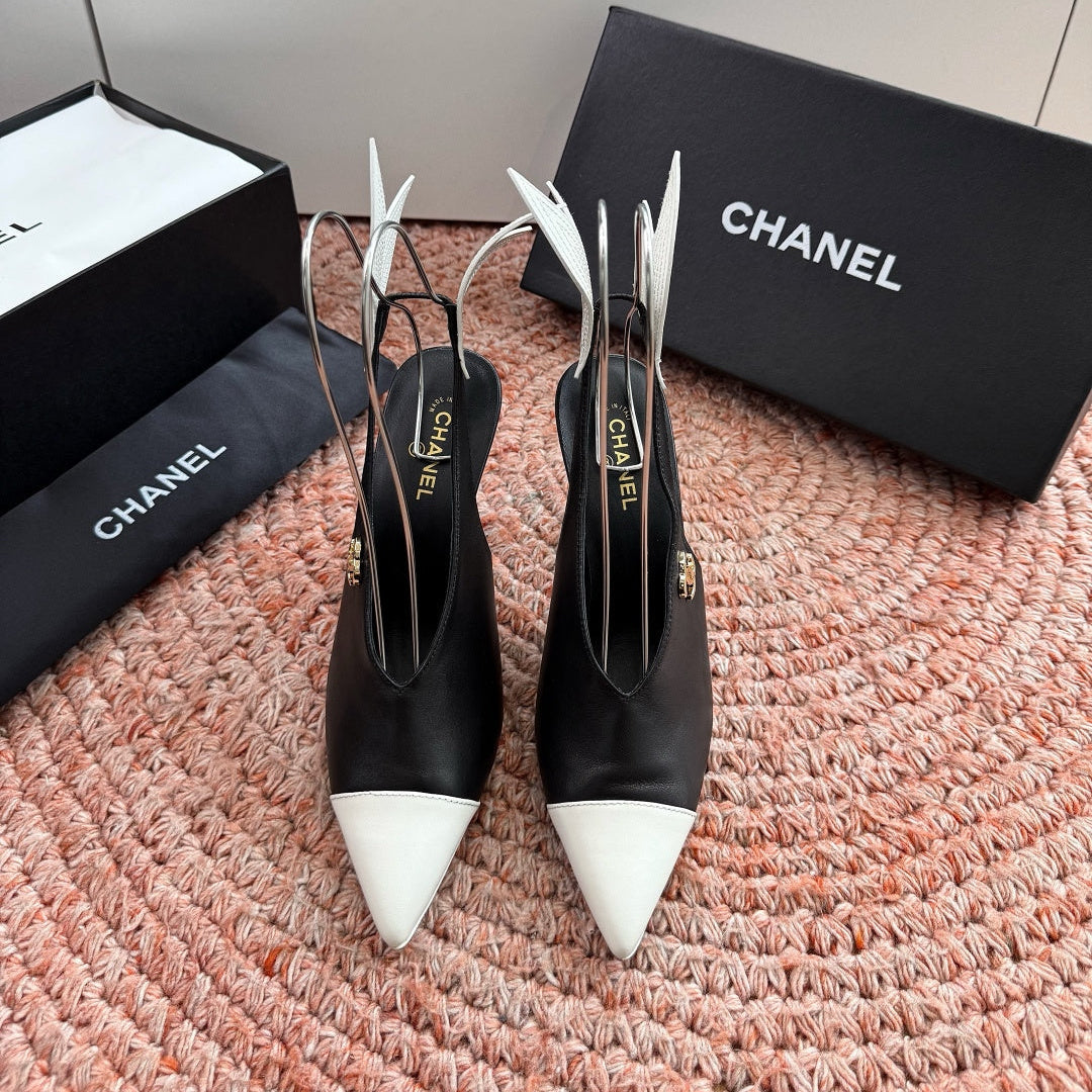 CHANEL 26S POINTED TOE HIGH HEEL SLINGBACKS IN BLACK AND WHITE LAMBSKIN WITH FLORAL APPLIQUE